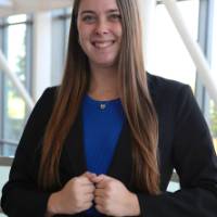 Person smiling wearing a pansuit